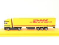 AMW H0 006738 Modellauto aus Set "Aus Danzas wird DHL" MB Actros 1:87 in Vitrine